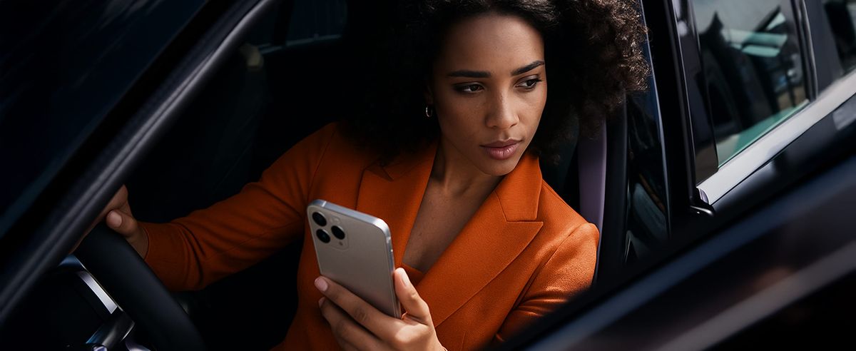 Business woman sitting in a business car