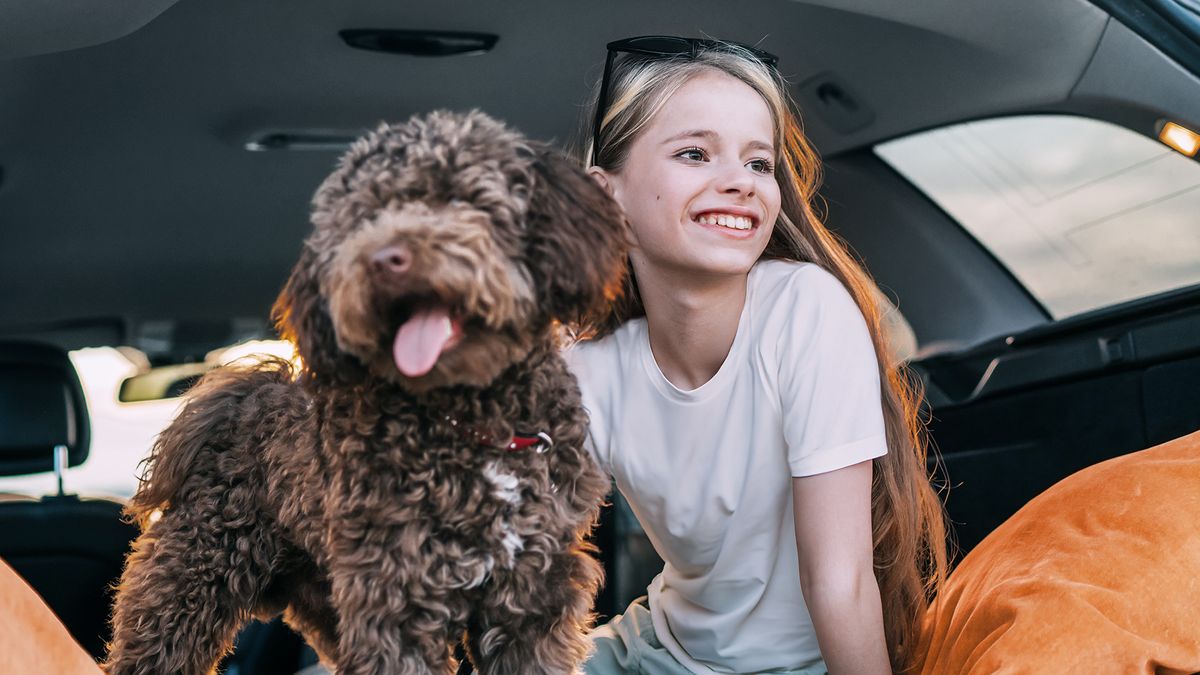 girl and dog in a SIXT family car rental