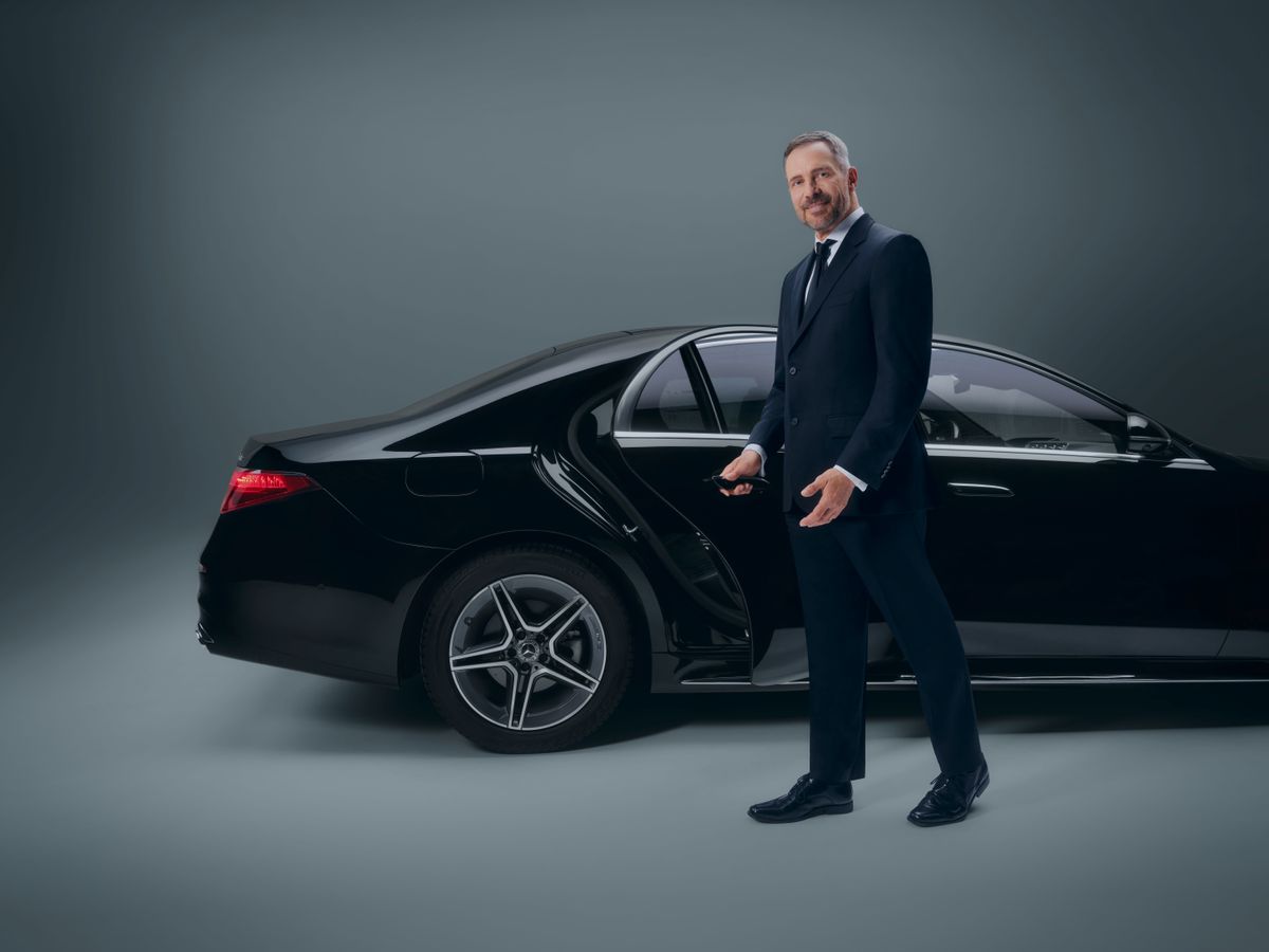 Businessman in the back seat of a limousine